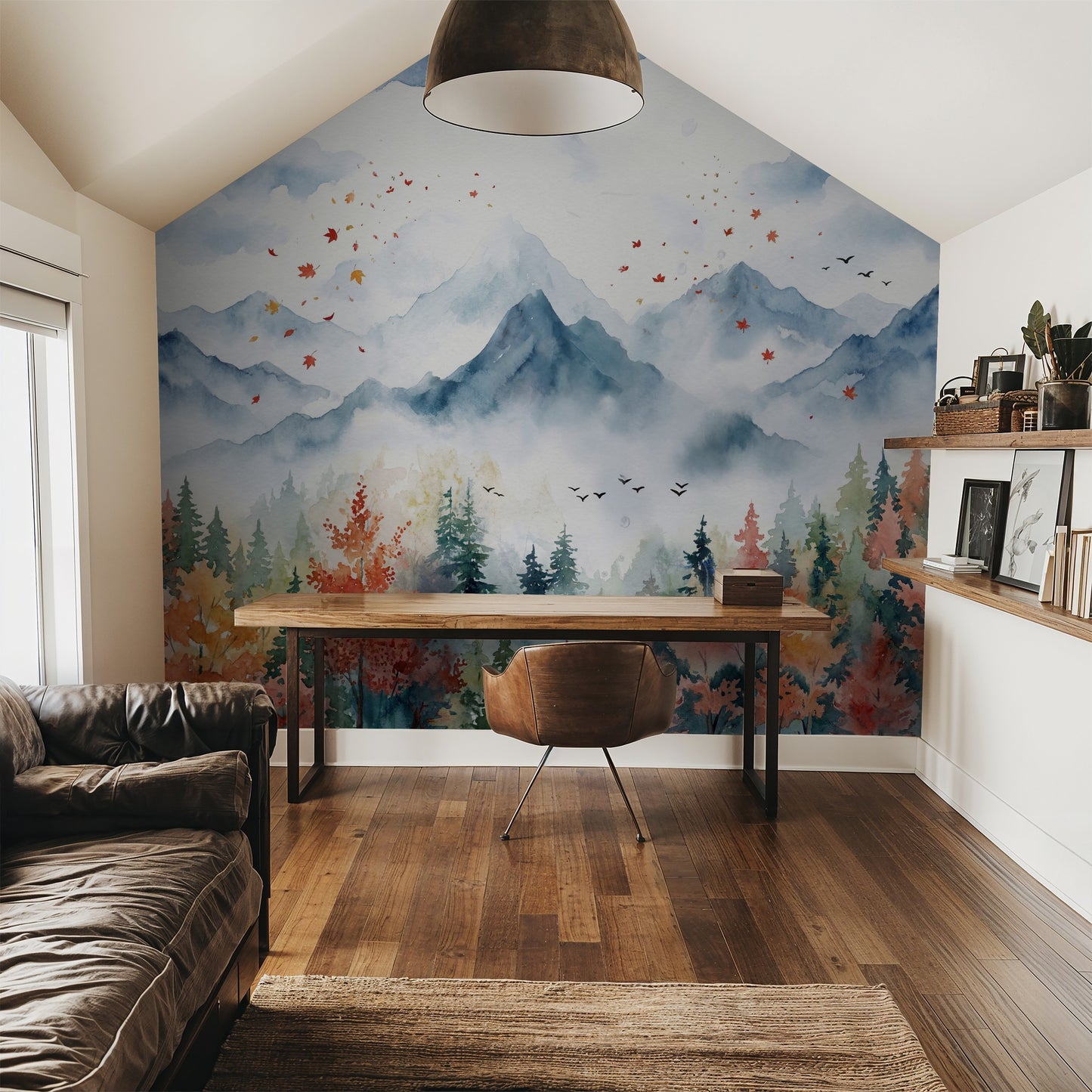 Watercolor mountain landscape wallpaper in cozy study with wooden desk and leather chair.